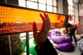 Closeup of woman warming hands at infrared heater Royalty Free Stock Photo