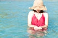 Closeup woman wearing red bikini playing sea water with happy feeling, Holiday and relax concept