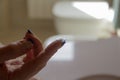 Closeup of a woman's hand holding a contact lens on her finger Royalty Free Stock Photo