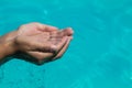 Woman's hands scooping water Royalty Free Stock Photo