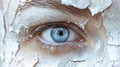 Closeup of womans eye with electric blue eye shadow, white paint, and eyeliner Royalty Free Stock Photo