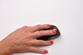 Closeup of a women hand using modern computer mouse on white su Royalty Free Stock Photo