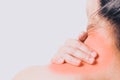 Closeup women neck and shoulder pain/injury with red highlights on pain area with white background, healthcare and medical concept Royalty Free Stock Photo
