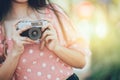 closeup women photographer hand holding vintage retro film camera outdoors space for text