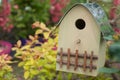 wooden bird house on tree in a garden at spring Royalty Free Stock Photo