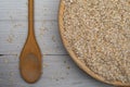 Closeup of a wooden bowl of oats Royalty Free Stock Photo