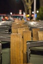 Closeup of wooden chairs lined up in a row Royalty Free Stock Photo