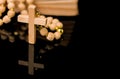 Closeup of wooden Christian cross on bible and prayer beads on black.Church utensils Royalty Free Stock Photo