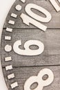 Closeup of a wooden clock half with embossed metal numbers Royalty Free Stock Photo