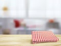 Closeup of wooden desk and tablecloth in room