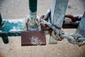 Closeup wooden door on the private road,locked with a chain and a rusty padlock Royalty Free Stock Photo