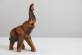 Closeup of a wooden elephant figurine isolated on a white background Royalty Free Stock Photo