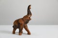 Closeup of a wooden elephant figurine isolated on a white background Royalty Free Stock Photo