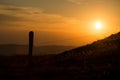 wooden fence silhouette at the top of themountain on sunset background Royalty Free Stock Photo