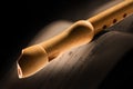 Wooden flute with musical score Royalty Free Stock Photo