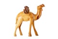 Closeup of a wooden handmade carved camel carrying two barrels isolated on white background Royalty Free Stock Photo