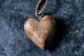 Closeup of a wooden heart-shaped pendant of a  necklace Royalty Free Stock Photo