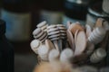 Closeup of wooden honey spoons in a container with a blurry background Royalty Free Stock Photo