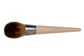 Closeup of a wooden new professional makeup brush isolated on a white background. Concept beauty. Macro.