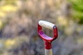 Closeup of wooden shovel in a garden or field with copy space. Zoom in on macro details, patterns and shape of a