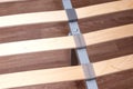 Closeup of wooden slats of a double bed. Birchen an arthopedic base of a bed