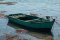 wooden small boat floating on the river Royalty Free Stock Photo