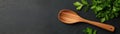 Closeup of wooden spoon with parise on dark background, a rustic culinary scene Royalty Free Stock Photo