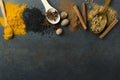 Top view of traditional sweet spices, woode spoons on the dark rustic table.Empty space for text Royalty Free Stock Photo