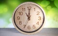 Closeup wooden wall clock show almost ten o`clock Royalty Free Stock Photo