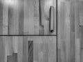 Closeup of wooden wardrobe or storage cupboard with doors and handles in black and white used for storing clothes and things