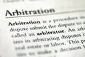 Closeup of The word Arbitration printed in textbook on white page.