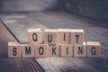 Closeup Of The Words Quit Smoking Formed By Wooden Blocks On A Wooden Floor