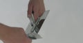 Closeup worker cleaning trowel from decorative concrete plaster