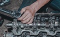 Closeup of a worker fixing an internal combustion engine Royalty Free Stock Photo