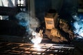 Closeup worker in a mask doing the welding in a workshop Royalty Free Stock Photo