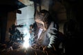 Closeup worker in a mask doing the welding in a workshop Royalty Free Stock Photo