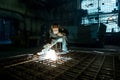 Closeup worker in a mask doing the welding in a workshop Royalty Free Stock Photo