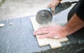 Closeup of a worker use cutting machine to cut a ceramic tile Royalty Free Stock Photo