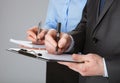 Closeup of working business team taking notes Royalty Free Stock Photo