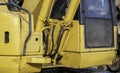 Closeup of a working used excavator, centered on hydraulics hoses Royalty Free Stock Photo