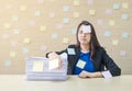 Closeup working woman are boring from pile of hard work and work paper in front of her in work concept on blurred wooden desk and Royalty Free Stock Photo