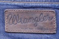 Closeup of Wrangler label on blue jeans.