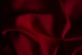 Closeup wrinkled dark red jersey, soft fabric background