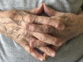 Closeup wrinkled hands of a senior person