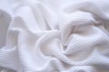 Closeup wrinkled white jersey, soft fabric background