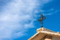 Wrought Iron Religious Cross on a Stone Roof - Lessinia Plateau Italy Royalty Free Stock Photo