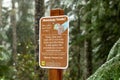 Closeup of "Stowaway seed" sign of USA forest service to control natural seed dispersal