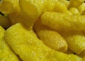 Closeup of yellow chips, potato fries background with black vignettes frame, food photography