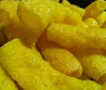 Closeup of yellow chips, potato fries background with black vignettes frame, food photography