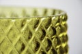 Closeup of a yellow glass vase texture surface